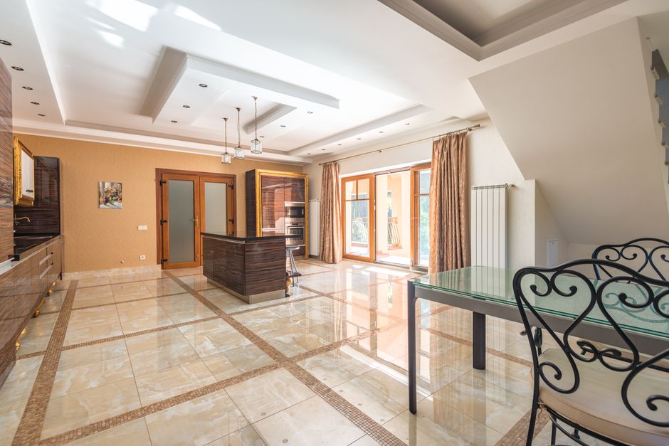 The bright and airy interior of a modern luxury home with minimalist decor, representing a property staged to sell for maximum value.