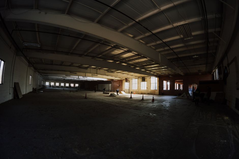 The interior of a hot, unfinished attic space with exposed wooden beams, illustrating a typical area in a Southeast Louisiana home needing insulation.